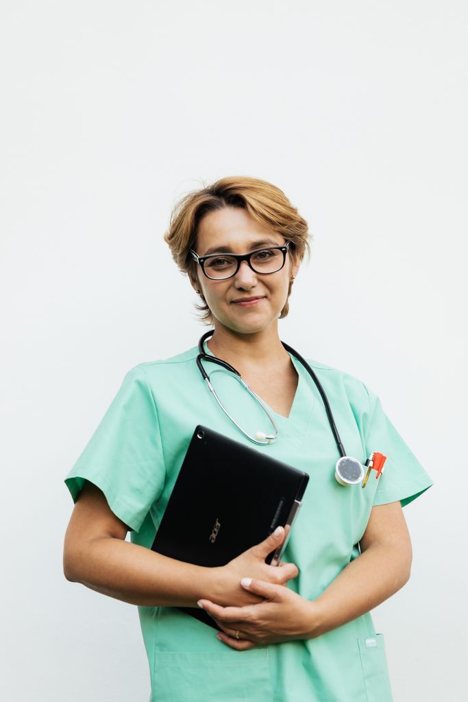 A healthcare professional or student who appears confident and happy.